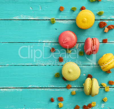 Multicolored cake of almond flour with cream macarons