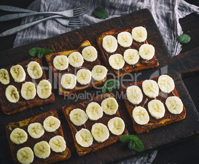 French toasts with chocolate and banana slices