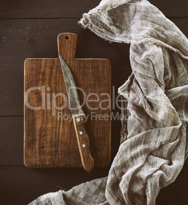 old brown wooden kitchen board with handle