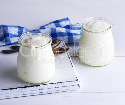 two glass jars with milk yoghurt homemade