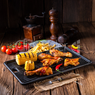 Rustic Grilled chicken wings,legs,and spicy corn