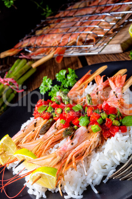 grilled red argentine shrimps with red salsa and green asparagus