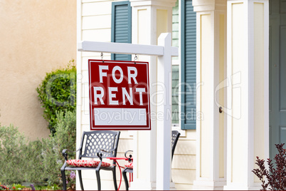 Red For Rent Real Estate Sign in Front House