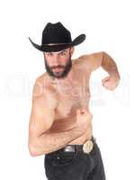Shirtless man with a cowboy hat showing his muscles