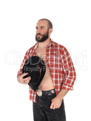 Young man with open shirt and cowboy hat