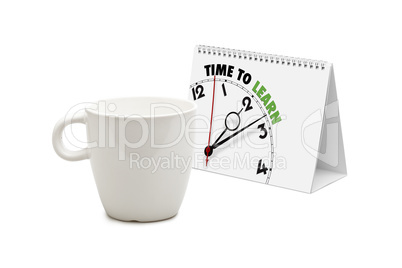 desk calendar with time to learn clock and blank mug