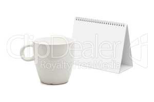 desk calendar and blank mug isolated