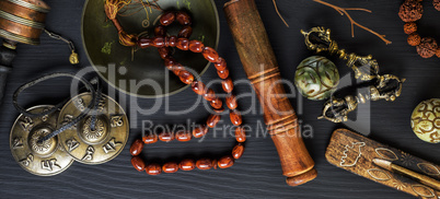 Copper singing bowl, prayer beads, prayer drum