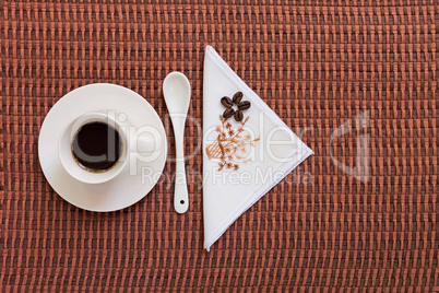 Coffee on tablecloth with coffee beans