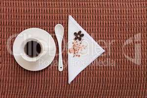 Coffee on tablecloth with coffee beans
