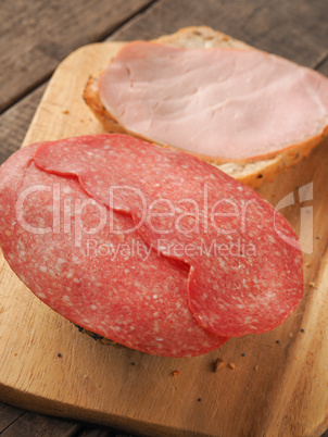 Tasty buns with ham and salami