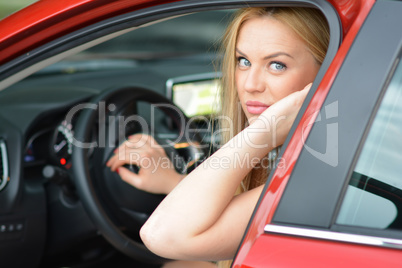 Pretty blonde driver girl ready for a trip