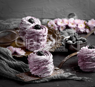 marshmallow with blueberries on an iron plate