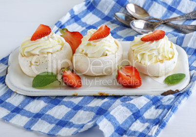 round baked meringue pie with strawberries