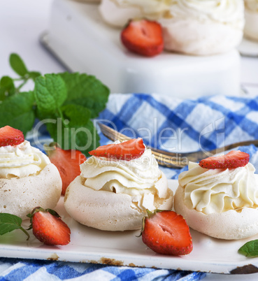 round baked meringue pie with strawberries