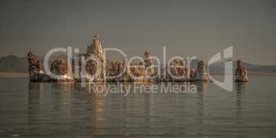 Panoramic View Of Rock Formation In Lake Against Sky