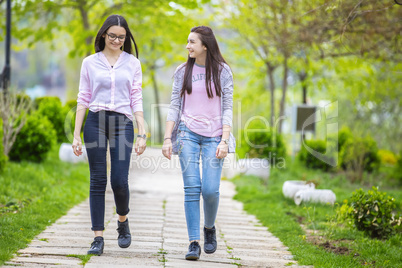 Two sisters having fun in the park