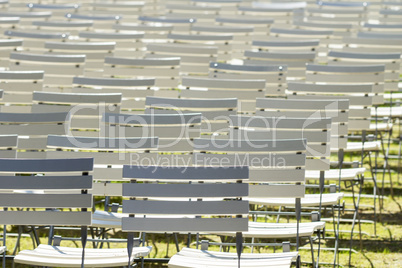 White chair rows in a spa park in dark