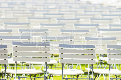 White chair rows in a spa park in bright