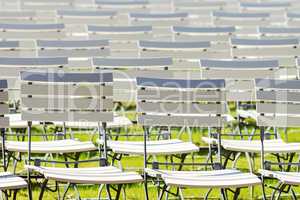 White chair rows in a spa park in medium light