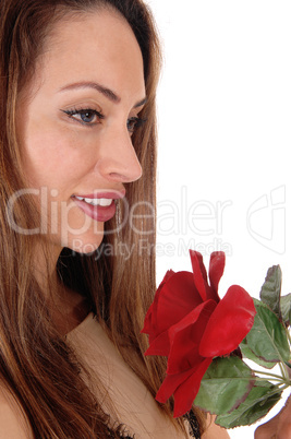 Closeup of the face of a woman with rose