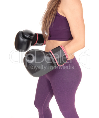 The middle section of a woman boxer