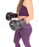 The middle section of a woman boxer