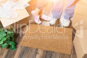 Man and Woman Standing Near Home Sweet Home Welcome Mat, Moving