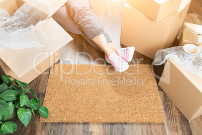 Woman Wearing Sweats Relaxing Near Home Sweet Home Welcome Mat,