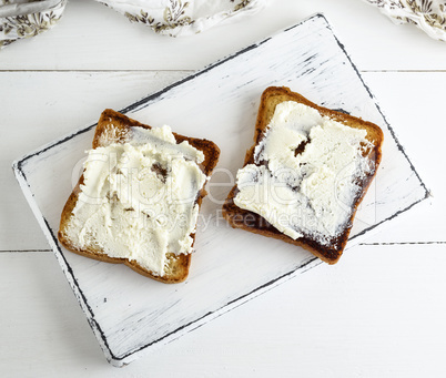 pieces of toasted bread with soft curd
