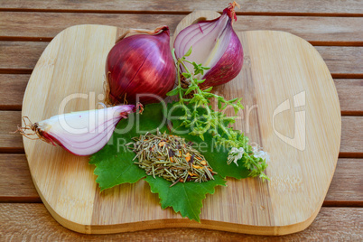 Red onion and spices on cutting board