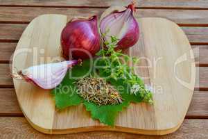 Red onion and spices on cutting board