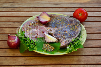 Tuna and Swordfish steaks with spices, side view