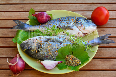 Sea breams with spices, side view