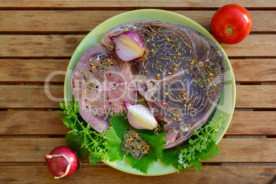 Tuna and Swordfish steaks with spices, top view