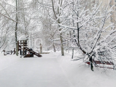 city park after snowfall at day