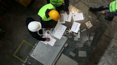 Workers and manager with documents