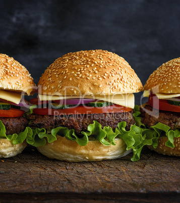 fresh homemade burger with lettuce, cheese, onion