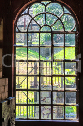 Old factory windows in an old abandoned workshop