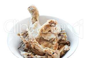 boiled chicken, quarter boiled chicken in a white plate, cooked chicken carcass