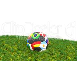 Soccer ball on grass with different flags