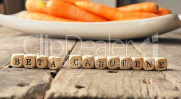 Beta carotene on wooden dices