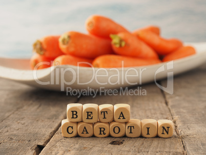 German Beta carotene on wooden dices