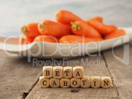 German Beta carotene on wooden dices