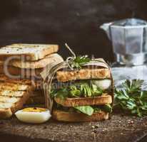 sandwich of French toast and lettuce leaves and boiled egg
