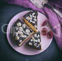 pieces of cheesecake with chocolate on a pink plate