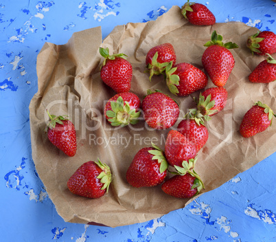 fresh ripe red strawberry on brown paper