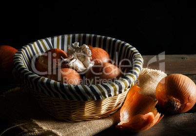 Still life of fresh onions and garlic head.