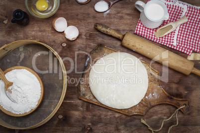 dough made from white wheat flour on a wooden board