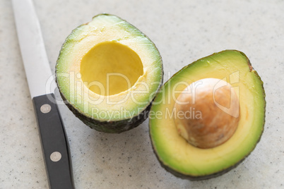 Fresh Cut Avocado on Wooden Cutting Board